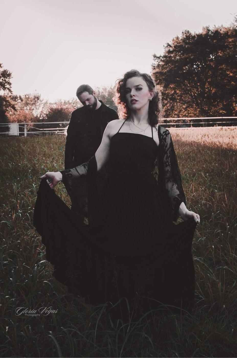 A couple in a moody outdoor editorial portrait