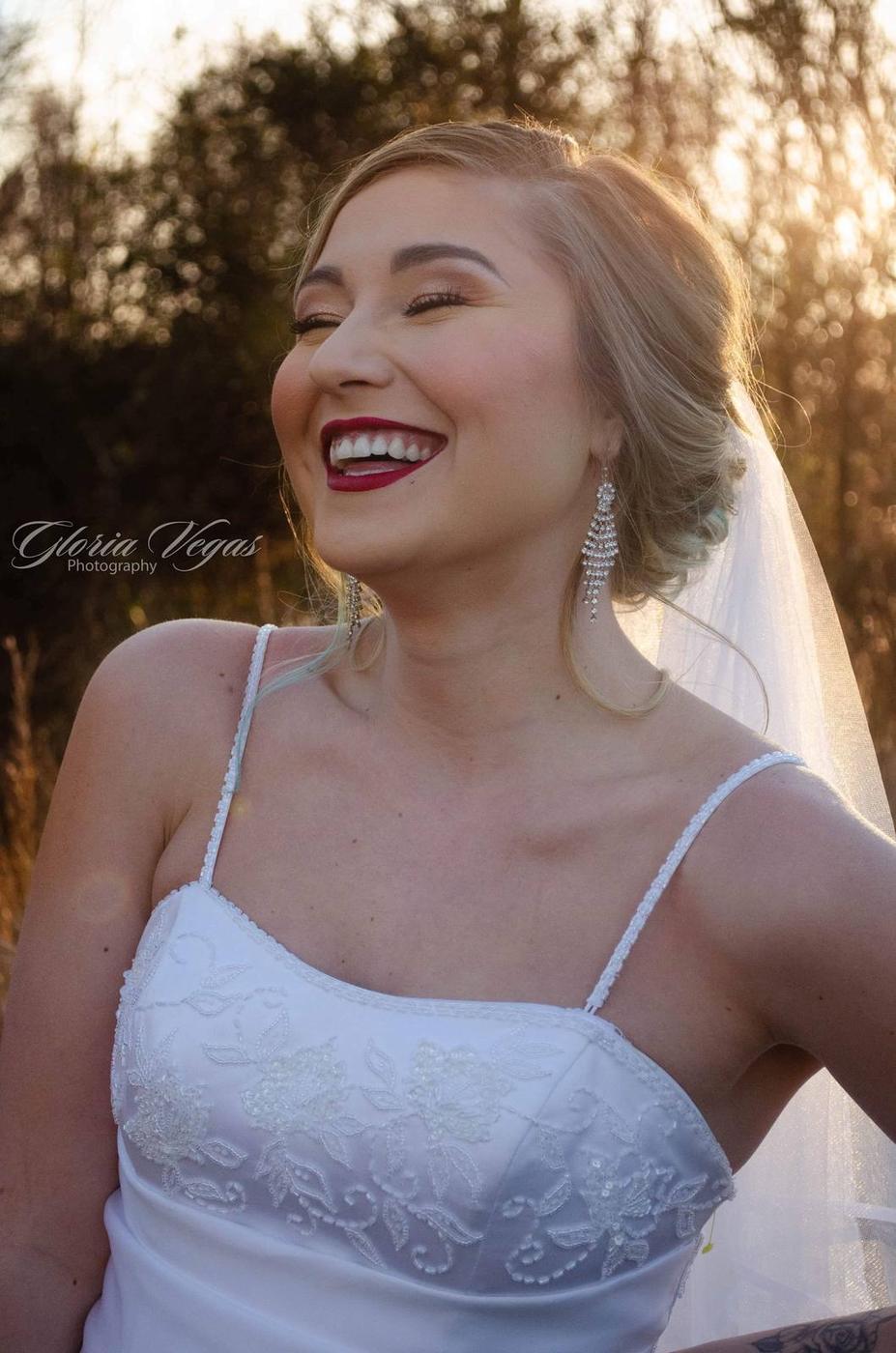 A bride laughing in golden evening light